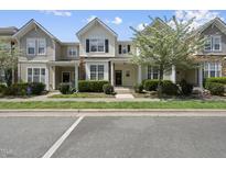 Charming townhomes featuring lush landscaping, stone accents, and inviting entryways at 4210 Brynwood Ave, Durham, NC 27713