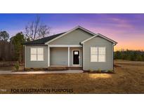 Charming single-story home featuring neutral siding, a covered porch, and a well-maintained front yard at 170 Brookhaven Dr, Spring Hope, NC 27882