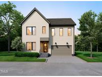Charming two-story home featuring a neutral color palette, a gray roof, and a two-car garage at 406 Columbia Dr, Raleigh, NC 27604