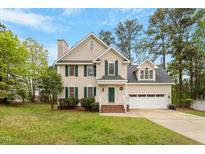Charming two-story home with a well-manicured lawn and inviting curb appeal at 903 Norwood Lane Ln, Apex, NC 27502