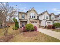 Charming townhouse featuring a well-maintained yard and inviting curb appeal at 1103 Kudzu St, Durham, NC 27713