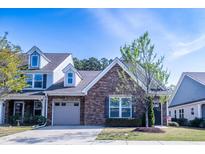 Charming home featuring stone accents, attached garage, and well-maintained landscaping at 150 Red Admiral Ct, Hillsborough, NC 27278