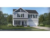 Charming two-story home with gray siding, black shutters, landscaped yard, and a two-car garage at 60 Glencoe Ln, Zebulon, NC 27597