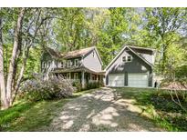 Charming two-story home with a separate garage and beautiful landscaping at 6105 Splitrock Trl, Apex, NC 27539