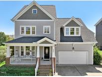Charming two-story home with a covered front porch and attached two-car garage at 904 Coral Bell Dr, Wake Forest, NC 27587