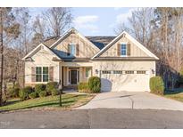 Charming single Gathering home with a two-car garage and well-maintained landscaping at 2000 Monthaven Dr, Wake Forest, NC 27587