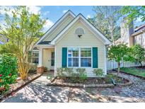 Charming single-story home featuring green shutters, a well-maintained yard, and a welcoming entryway at 5016 Silhouette Dr, Durham, NC 27713