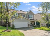 Charming two-story home with a two-car garage, stone accents, and well-maintained landscaping at 617 Conover Rd, Durham, NC 27703