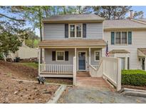 Charming home featuring a welcoming front porch, neutral siding, and well-maintained landscaping at 6568 English Oaks Dr, Raleigh, NC 27615