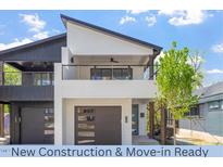 New construction home featuring a modern design with a front-facing balcony and spacious garages at 730 Hopkins St, Durham, NC 27701
