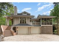 An inviting home with an attached two car garage and a screened porch at 1011 Wood Sage Dr, Chapel Hill, NC 27516
