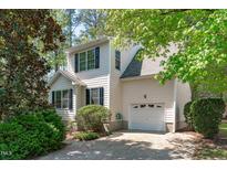 Charming two-story home with white siding, black shutters and attached one car garage at 113 Weatherhill Pt, Carrboro, NC 27510