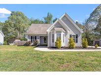 Charming single-Gathering home with well-manicured lawn and bay window at 310 Cedarhurst Ln, Franklinton, NC 27525