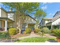 Charming townhouse with lush landscaping, inviting front porch, and well-maintained exterior features at 507 Presque Isle Ln # Bldg 500, Chapel Hill, NC 27514