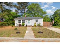 Charming single-story home with a manicured front yard and a welcoming entrance at 509 N Elm St, Benson, NC 27504