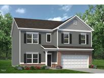 Charming two-story home with gray siding, black shutters, and a brick garage in a well landscaped neighborhood at 164 E Victory View. Ter, Smithfield, NC 27577