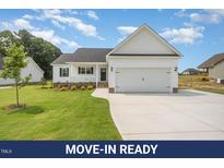 Charming single-Gathering home featuring a well-manicured lawn and a two-car attached garage at 172 Royal Ave, Selma, NC 27576