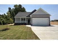 Charming one-story home with a two-car garage and covered porch at 192 Royal Ave, Selma, NC 27576