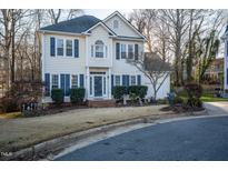 Charming two-story home featuring blue shutters, manicured landscaping, and a welcoming front entrance at 3100 Benton Cir, Raleigh, NC 27615