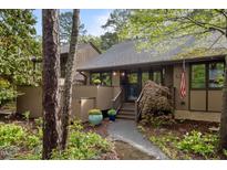 Inviting home with a charming walkway, landscaped garden, and classic architectural details at 33 Stoneridge Cir, Durham, NC 27705