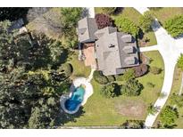 Stunning aerial view of the house with a beautiful backyard and an inviting blue swimming pool at 40 Farrells Creek Rd, Apex, NC 27523