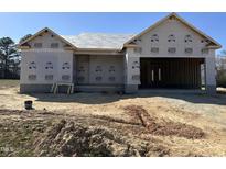 New construction home's exterior shows the framing and initial construction with a focus on the building's design at 69 Tee Dr, Selma, NC 27576