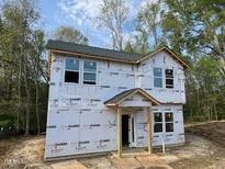 New construction shows the front of the home before siding and paint at 12 Gates St, Roxboro, NC 27573