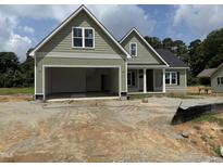Charming home featuring a two-car garage and pleasant curb appeal at 125 Tee Dr, Selma, NC 27576