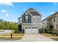Beautiful two-story home with a two car garage and manicured front yard at 2901 Murray Ridge Trl, Apex, NC 27502