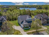 Beautiful home with manicured lawn, lakeside views and neighborhood amenities at 4424 Bonnie Loch Dr, Burlington, NC 27215