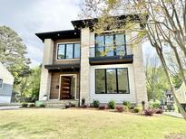 Stunning two-story home featuring modern architecture and a well-manicured lawn at 622 Glascock St, Raleigh, NC 27604