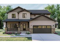 Charming two-story home with a covered front porch, stone accents and a spacious two-car garage at 7401 Ray Rd, Raleigh, NC 27613