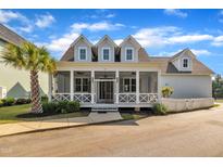 Charming home with a covered front porch and beautifully landscaped yard at 39 Drayton St, Clayton, NC 27527