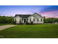 Charming single-story home with a well-maintained lawn and inviting curb appeal at 16 Monarch Trl, Selma, NC 27576