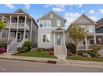 Charming two-story home with landscaped yard and inviting front porch, complemented by neighboring residences at 282 Granite Mill Blvd, Chapel Hill, NC 27516