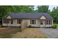 Charming duplex with red shutters, a new roof, and low maintenance landscaping at 56 Marlless Dr # A & B, Franklinton, NC 27525