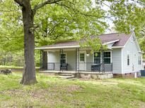 Charming home with a covered porch and mature shade tree at 808 E Hanover Rd, Graham, NC 27253