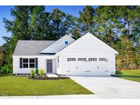 Charming single-story home with a well-manicured lawn, attached garage, and inviting curb appeal at 107 Port Charlotte Ct, Sanford, NC 27330