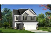 Charming two-story home featuring a gray facade, white trim, and a two-car garage at 2006 Cross Bones Blvd # 34, Durham, NC 27703