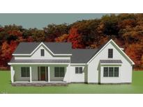 Charming new construction home with a welcoming front porch and craftsman details at 435 Pilot Ridge Rd, Zebulon, NC 27597