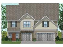 Charming two-story home showcasing a symmetrical facade, double garage, and welcoming entryway at 280 N Maple Walk # 233, Garner, NC 27529