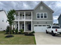 Charming two-story home with a welcoming porch and well-maintained landscaping at 4118 Rillcrest Grove Way, Fuquay Varina, NC 27526