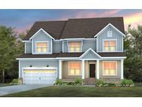 Charming two-story home showcasing a modern design, garage, and well-manicured landscaping at 63 W Silver Bridle Trl, Wendell, NC 27591