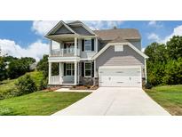 Charming two-story home with a two-car garage, balcony, and well-manicured lawn at 0 Sawmill, Cedar Grove, NC 27231