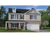 Two-story home with brick and siding exterior, a covered porch, and an attached two-car garage at 1204 Pavo Path, Wendell, NC 27591