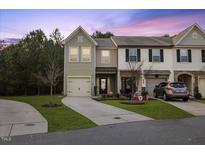 Charming townhome with a well-maintained front yard and an attached garage at 3735 Landshire View Ln, Raleigh, NC 27616