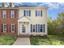 Charming two-story home featuring blue shutters, cream siding, and a welcoming front entrance at 5013 Dunwoody Trl, Raleigh, NC 27606