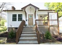 Charming home featuring a covered porch, landscaped yard, and a welcoming entryway at 808 Grace Ave, Burlington, NC 27217