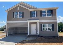 Two-story home with gray siding, black shutters, a large front-facing garage, and a light-colored front door at 84 Grove Township Way, Angier, NC 27501