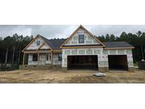 New construction home featuring a two-car garage and covered porch at 115 Sanders Farm Dr, Smithfield, NC 27577